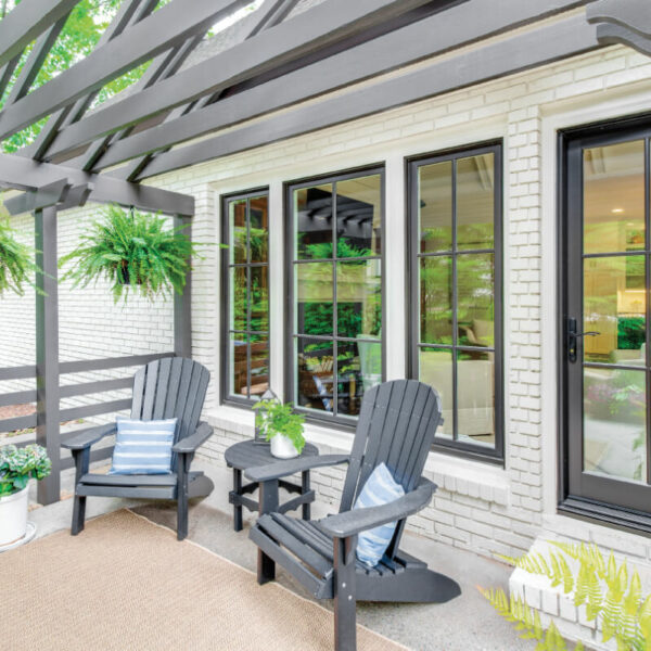 Infinity from Marvin Exterior patio image featuring Infinity Casement Windows, an Infinity Picture Window, and an Infinity Inswing French Door in Bronze exterior finish with Oil Rubbed Bronze hardware.